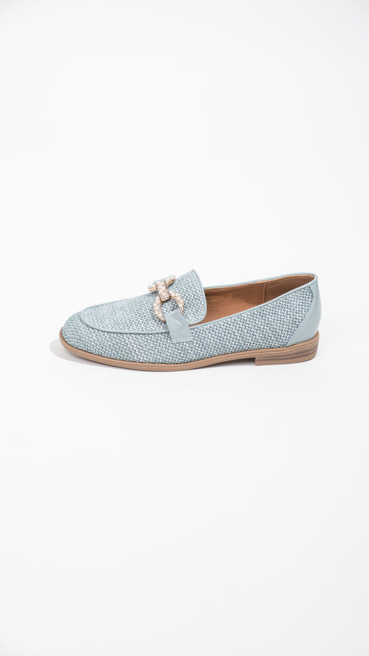 Manuella blue moccasins with buckles, showcasing soft material and stylish design, ideal for casual wear.