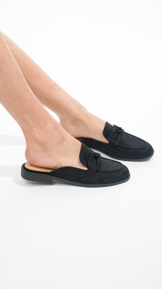 Black Manuella women's mules featuring a stylish design and comfortable fit, perfect for casual or dressy occasions.