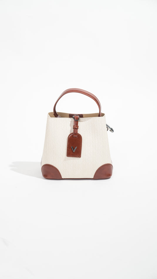 Sac à main femme blanc de la marque Manuella, en cuir élégant avec poignées et fermeture métallique visible.